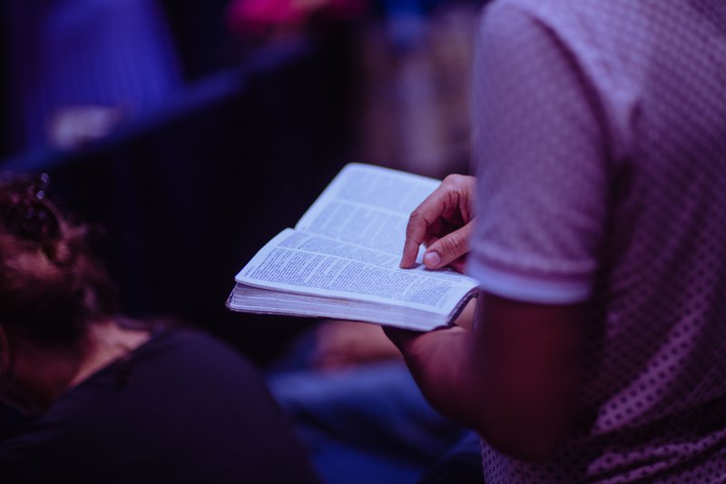 selective-focus-photo-of-person-holding-book-2351719.jpg